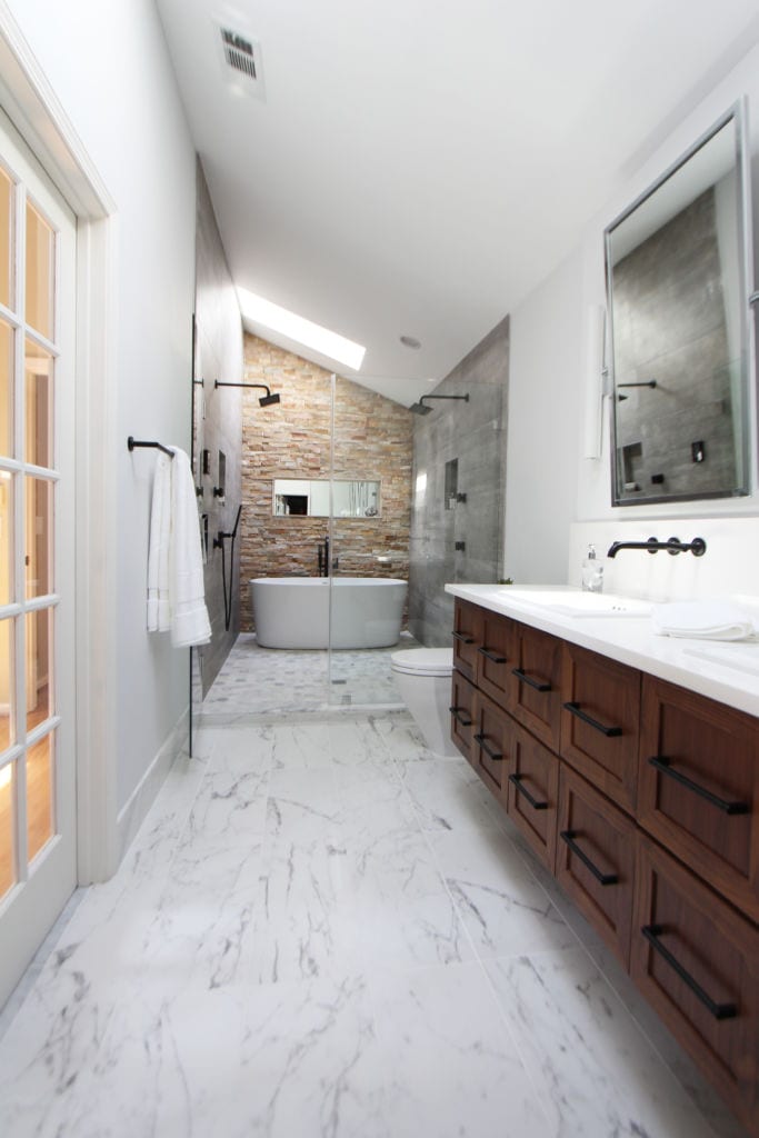 Luxury bathroom remodel atlanta walnut vanity marble floor open long bathroom freestanding tub stacked stone bathroom black faucets bathroom remodel ideas